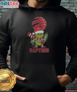 Happy Toronto Raptors fan wearing a Christmas Grinch Santa hat and 2025 holiday hoodie, celebrating the festive season.