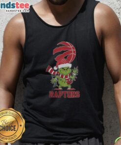 Alt Text: Happy Toronto Raptors fan wearing a Christmas Grinch Santa hat and holiday tank top for 2025 celebrations.
