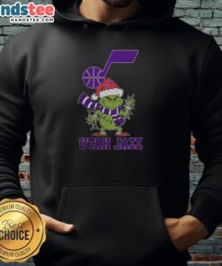 Alt Text: Happy Utah Jazz Christmas hoodie with Grinch design and Santa hat, perfect for holiday cheer in 2025.