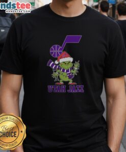 Happy Utah Jazz Christmas Grinch wearing a Santa hat on a holiday 2025 T-shirt, perfect for festive basketball fans.