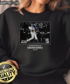 Eugenio Suarez in a Seattle Mariners NLCS 2025 MLB postseason moment, wearing a stylish sweatshirt celebrating his performance.