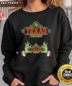 Alt Text: Cozy Hot Grinch Hands Love Texas Roadhouse Merry Christmas sweatshirt, perfect for holiday celebrations and festive cheer.
