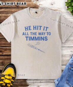 Alt Text: Hot He Hit It All The Way To Timmins washed t-shirt displayed on a hanger, showcasing its soft fabric and trendy design.