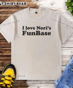 Alt Text: Hot I Love Noris Funbase washed t-shirt displayed on a wooden background, showcasing a trendy casual style.