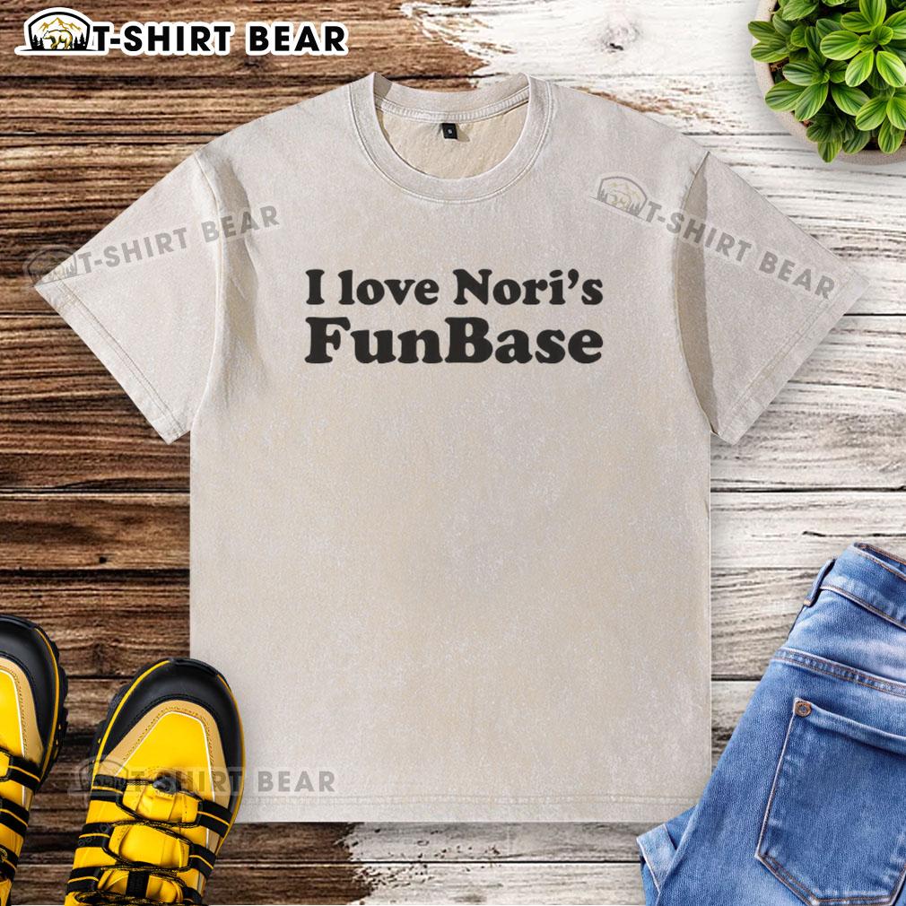 Hot I Love Nori'S Funbase Washed T Shirt Alt Text: Hot I Love Noris Funbase washed t-shirt displayed on a wooden background, showcasing a trendy casual style.