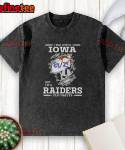 Hot I May Live In Iowa But I'm A Raiders Fan Forever washed t-shirt displayed on a hanger, showcasing team spirit.