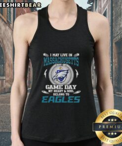 Alt Text: Woman wearing a Philadelphia Eagles tank top, showcasing pride for her team despite living in Massachusetts on game day.
