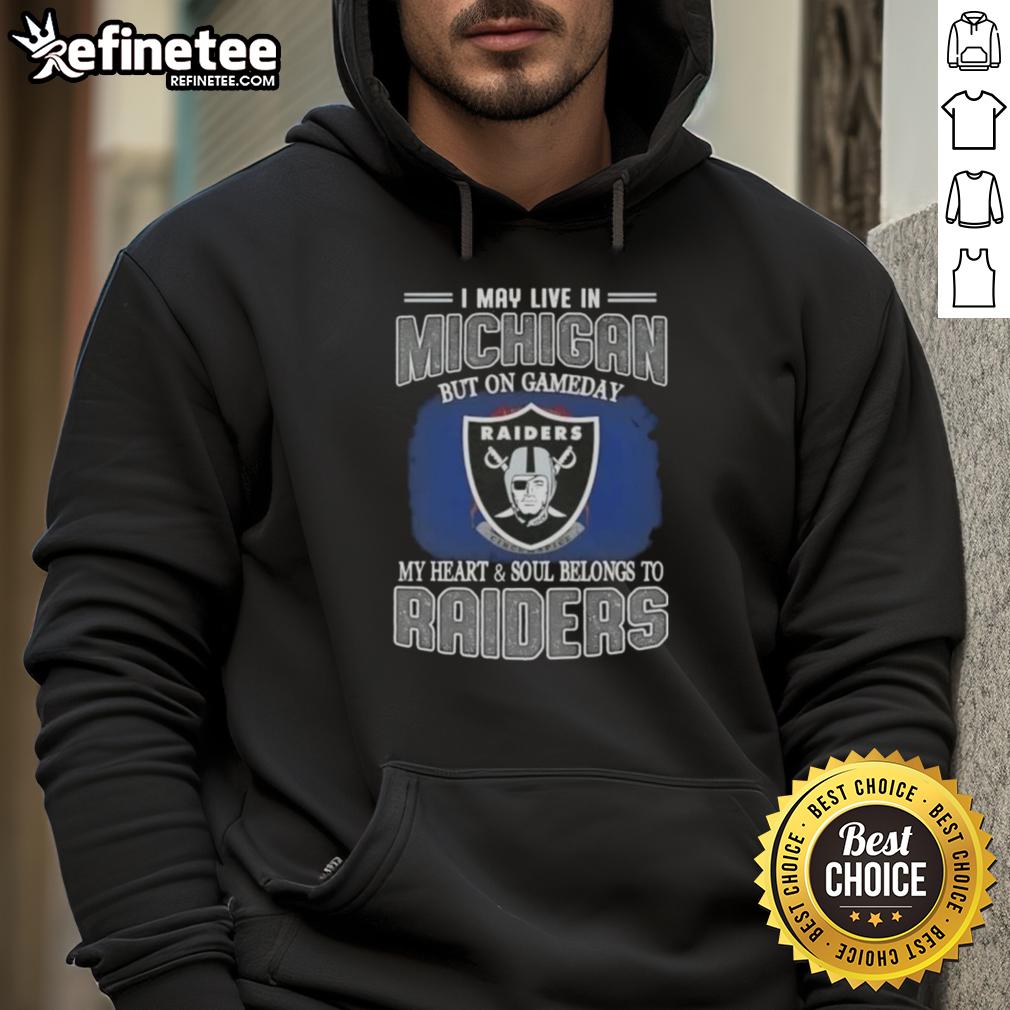 hot-i-may-live-in-michigan-but-on-gameday-my-heart-and-soul-belongs-to-raiders-hoodie Fan wearing 'Hot I May Live in Michigan But on Gameday My Heart and Soul Belongs to Raiders' hoodie, showing team spirit.