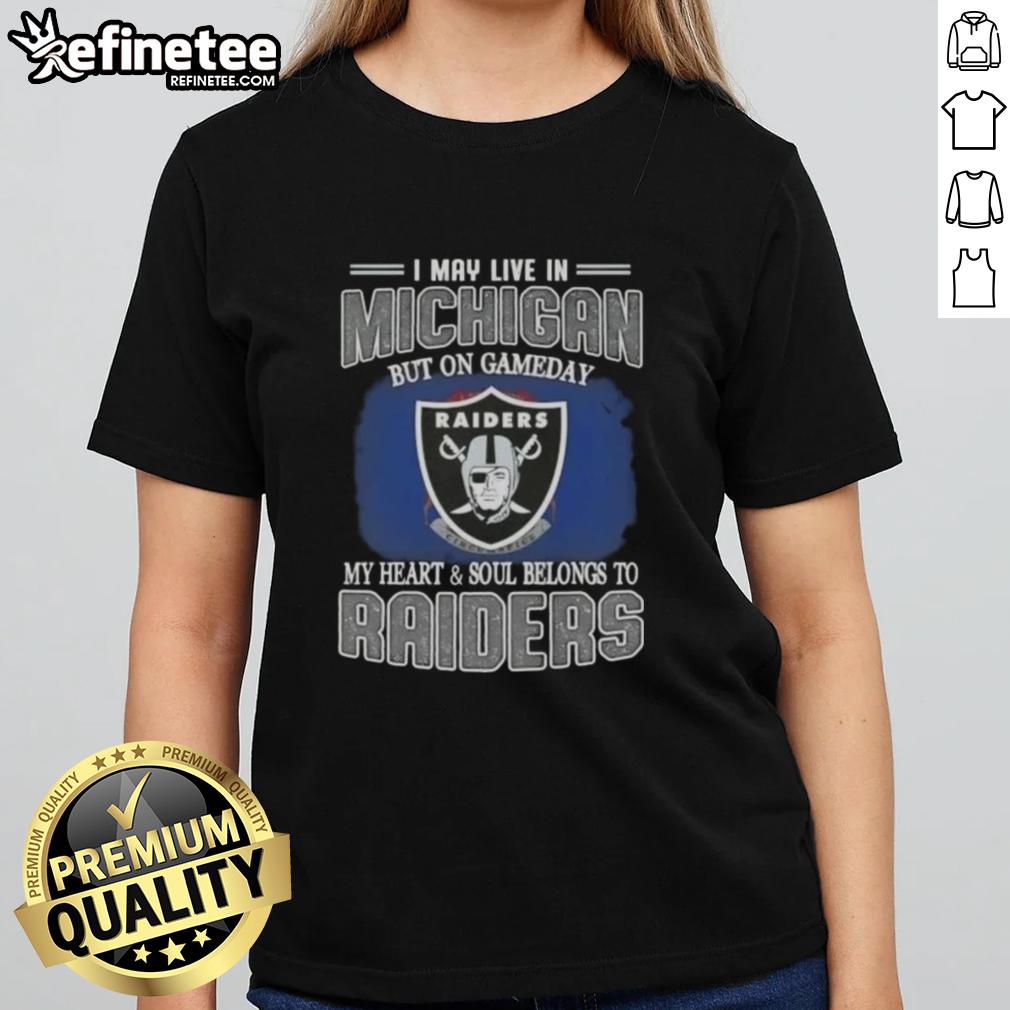 hot-i-may-live-in-michigan-but-on-gameday-my-heart-and-soul-belongs-to-raiders-ladies-tee Hot I May Live in Michigan but on Gameday My Heart and Soul Belongs to Raiders Ladies Tee design with team colors.