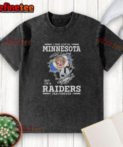 Hot I May Live in Minnesota But I'm A Raiders Fan Forever washed t-shirt featuring bold Raiders graphics and vintage style.