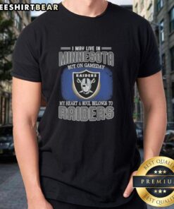Alt Text: Hot I May Live In Minnesota But On Gameday My Heart And Soul Belongs To Raiders T-Shirt, perfect for fans.