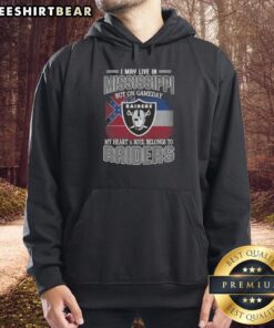 Fan wearing a 'Hot I May Live in Mississippi But On Gameday My Heart and Soul Belongs to Raiders' hoodie at a game.