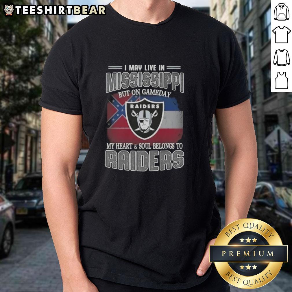Hot I May Live In Mississippi But On Gameday My Heart And Soul Belongs To Raiders T-Shirt Alt Text: Hot I May Live In Mississippi But On Gameday My Heart And Soul Belongs To Raiders T-Shirt displayed on a hanger.