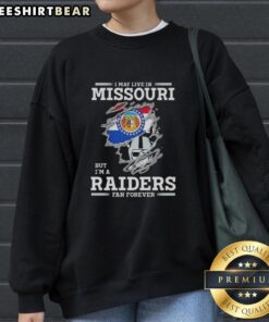 Cozy sweatshirt saying 'Hot I May Live In Missouri But I'm A Raiders Fan Forever' perfect for loyal Raiders fans.