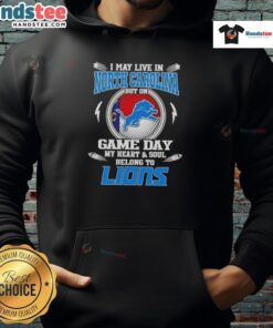 Person wearing a Detroit Lions hoodie that reads 'Hot I May Live in North Carolina But On Game Day My Heart Belongs to Detroit Lions.'
