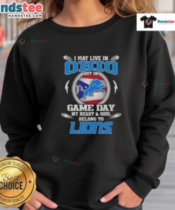 Ohio fan wearing a Detroit Lions sweatshirt, showcasing team spirit on game day with vibrant colors and logo.