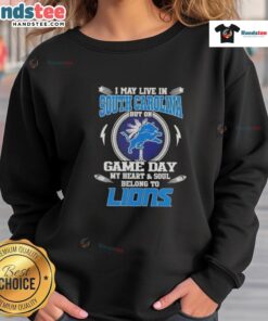Alt Text: Comfortable sweatshirt featuring 'I may live in South Carolina but on game day my heart belongs to Detroit Lions'
