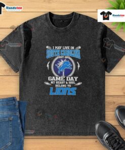 Washed t-shirt featuring 'Hot I May Live In South Carolina But On Game Day My Heart And Soul Belongs To Detroit Lions' text.