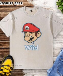 Hot Mario Bros Wii'd smoking washed t-shirt featuring vibrant graphics of Mario in a playful pose.