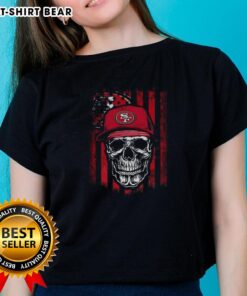 Hot San Francisco 49ers NFL skull graphic on American flag design for football lover ladies' tee.