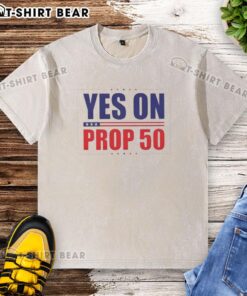 Alt Text: Hot Yes On Prop 50 Stars Washed T-Shirt featuring a stylish design in a vintage wash, perfect for casual activism.