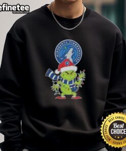 2025 Minnesota Timberwolves Christmas sweatshirt featuring Grinch in Santa hat, perfect for holiday cheer.