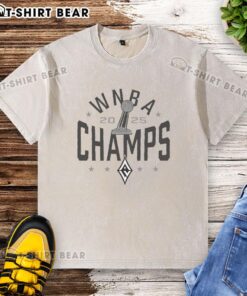 Las Vegas Aces WNBA Champs 2025 trophy logo on a washed t-shirt, celebrating their championship victory.