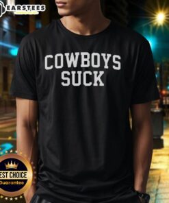 Fan wearing a 'Cowboys Suck' t-shirt at the Chiefs vs Lions game, showcasing team spirit and excitement.