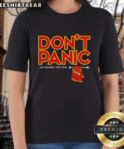 Women wearing 'Don't Panic' T-shirts with towels, embracing a relaxed vibe in a sunny outdoor setting.