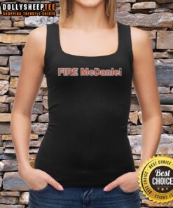 Mike McDaniel in a Miami Dolphins tank top, showcasing team spirit with a vibrant fire design for football fans.