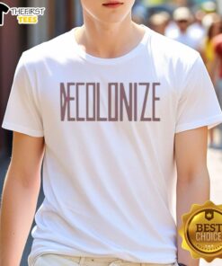 Greta Thunberg smiling in a Decolonize T-shirt, promoting environmental awareness and social justice.