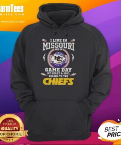 Fan wearing a Kansas City Chiefs hoodie, showcasing pride for Missouri on game day. Perfect for NFL enthusiasts.