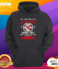 Fan wearing a Kansas City Chiefs hoodie, showcasing pride with the text 'Nice, I may live in Alabama, but on game day...'