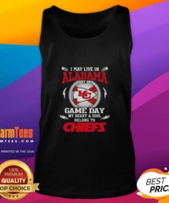 Woman wearing a Kansas City Chiefs tank top, showcasing team pride on game day while living in Alabama.
