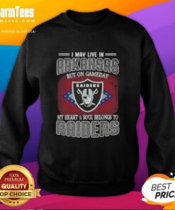 Cozy sweatshirt reading 'I May Live In Arkansas But On Gameday My Heart And Soul Belongs To Raiders' in vibrant colors.