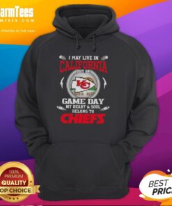 Person wearing a Kansas City Chiefs hoodie, showcasing team spirit despite living in California on game day.