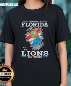Florida ladies tee featuring 'I May Live In Florida But I'm A Lions Fan Forever' design for passionate Detroit Lions fans.