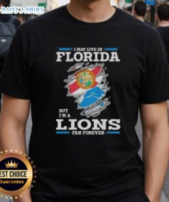 Nice I May Live In Florida But I'm A Lions Fan Forever T-Shirt featuring bold text and vibrant colors for passionate fans.