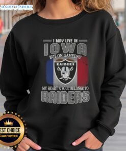 Cozy Raiders sweatshirt with 'I may live in Iowa, but on game day my heart and soul belongs to Raiders' printed design.