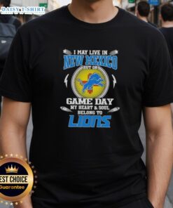 Alt Text: Detroit Lions T-shirt expressing loyalty, featuring 'I May Live In New Mexico But On Game Day My Heart Belongs To Detroit' design.