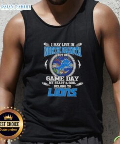 Alt Text: Woman wearing Detroit Lions tank top, showcasing team spirit on game day in North Dakota.