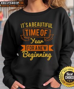 Cozy sweatshirt featuring 'It's a beautiful time of year for a new beginning' design, perfect for autumn fashion.