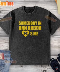 Nice Michigan 'Somebody in Ann Arbor Loves Me' washed t-shirt displayed on a rustic wooden background.