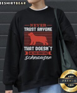 Cozy sweatshirt featuring 'Never Trust Anyone That Doesn't Like Your Miniature Schnauzer' design, perfect for dog lovers.