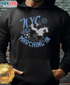 New York City FC hoodie worn by fans marching in support of NYC soccer team during a game day event.