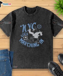 Alt Text: New York City FC fan wearing a washed t-shirt at a match, celebrating NYC's vibrant soccer culture.