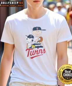 Alt Text: Snoopy and Charlie Brown on Minnesota Twins baseball T-shirt, featuring cute Peanuts characters in team colors.