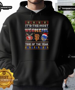 Alt Text: Cozy Christmas hoodie featuring San Francisco 49ers, Giants, and Warriors logos, perfect for holiday sports fans.