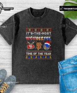 Christmas-themed washed t-shirt featuring San Francisco 49ers, Giants, and Warriors logos in festive design.