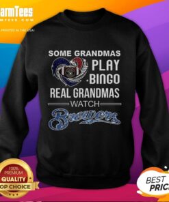 Grandmas in a Milwaukee Brewers baseball sweatshirt enjoy a game, showcasing love for baseball over bingo.